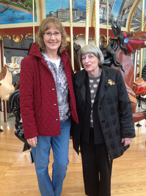 Janet Dodrill with Terry Kovel (Cleveland antiques expert and Chairperson of Cleveland's Euclid Beach Park Carousel Society) visiting the carousel construction in progress at the Western Reserve Historical Society.