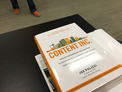 Joe Pilluzi's book, Content Inc. (Joe likes the color orange and orange shoes!).