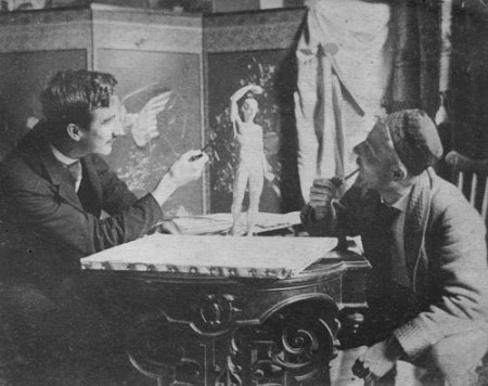 Hugo Max Schmitz (right) with his signature pipe, Paris,1890s.